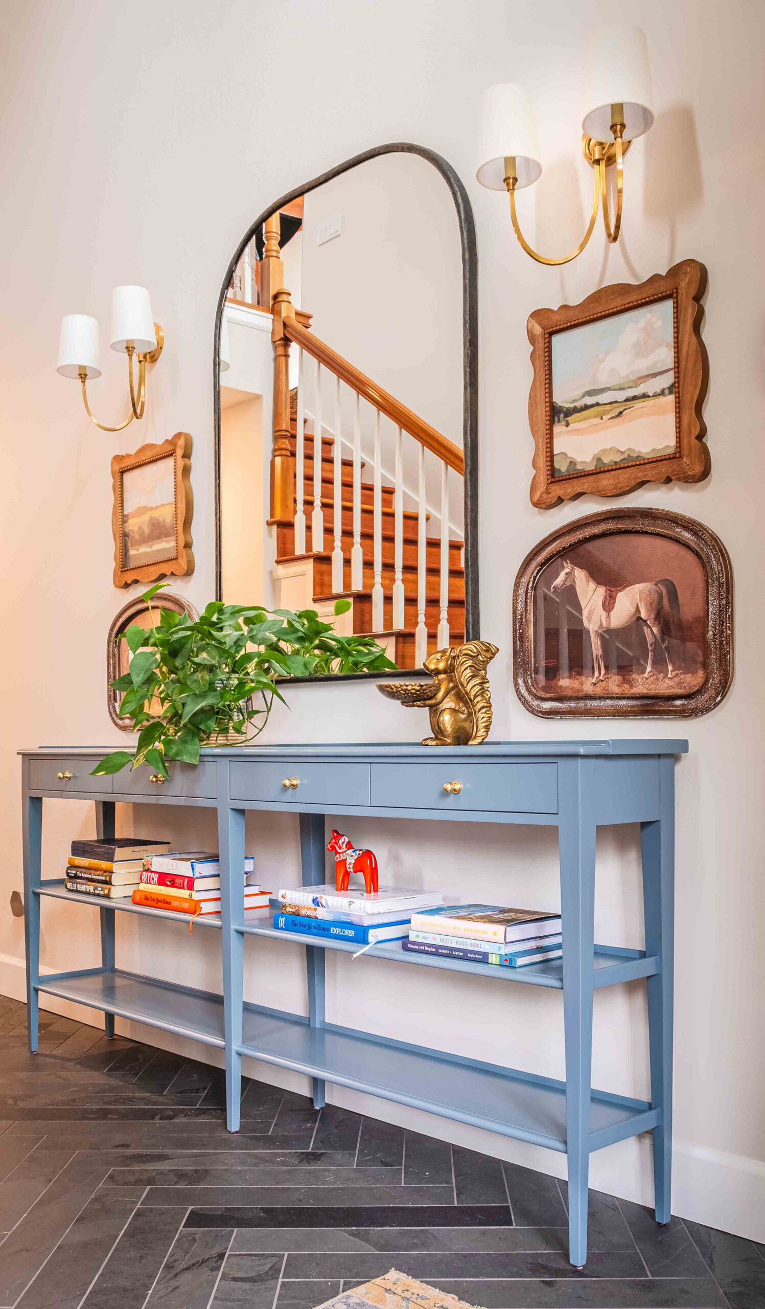 Anchorage Entryway with Blue Console Table and Art Designed and photographed by Kjerstin Boorstein Interiors, Anchorage, Alaska.